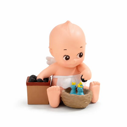 Kewpie In the Garden – Kewpie Feeds Birds